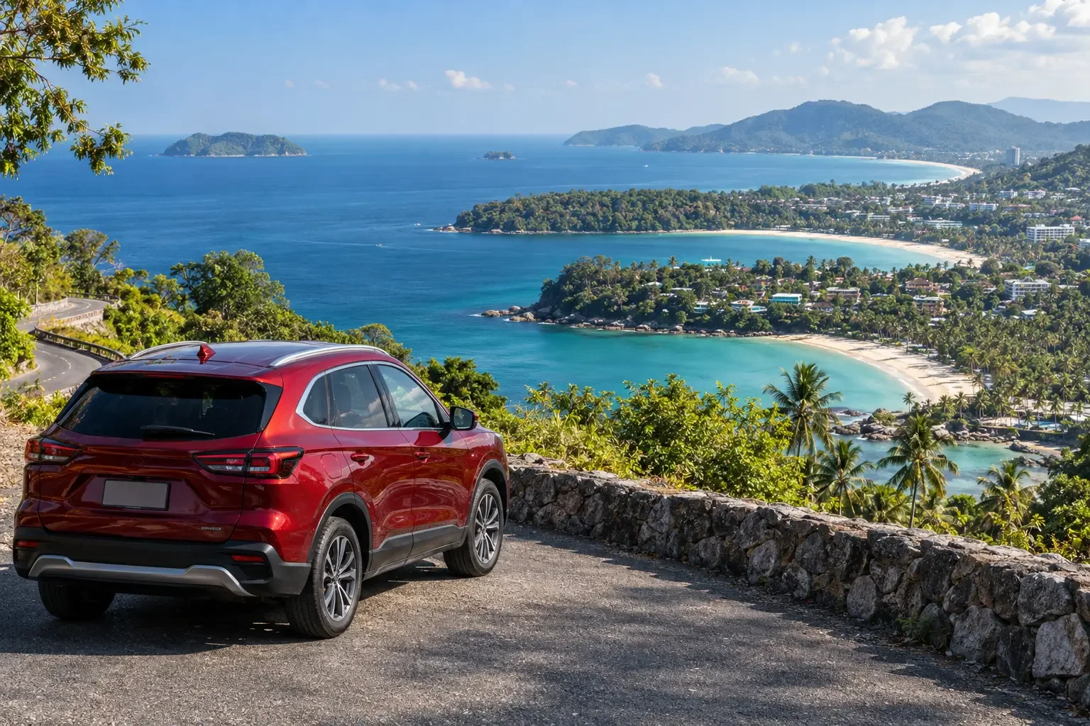 Red crossover on a scenic Phuket coastal viewpoint road above turquoise sea and palm-lined beaches